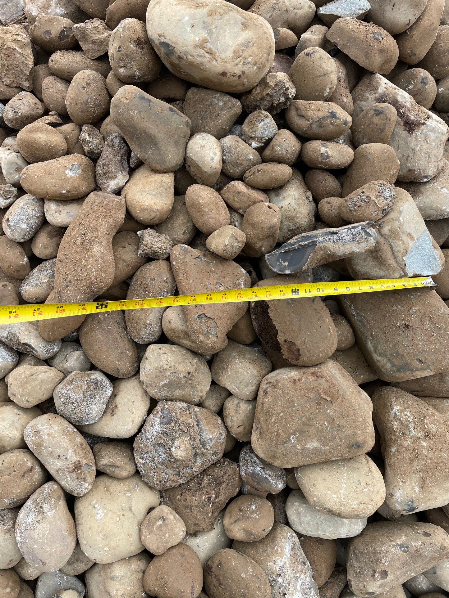 4" to 5" River rock rounds. Cost is per ton.